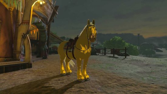 Gilded horse outside stable