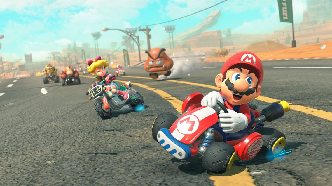 Super Mario and Princess Peach powersliding their karts during a race in the Switch 2 exclusive Mario Kart World.