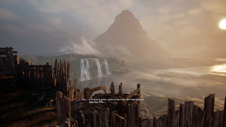 Scenic mountain view at sunset with cascading waterfall and wooden structure in the foreground.