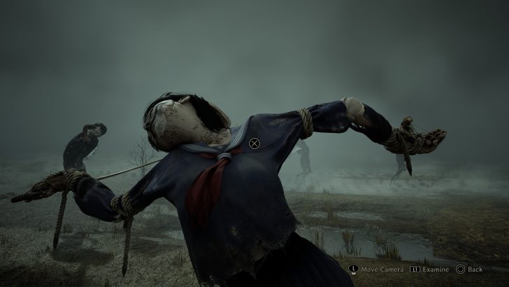 Creepy scarecrow with a school uniform and ropes in a foggy field, with button prompts Examine and Back.