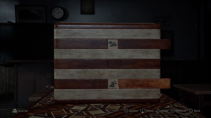 A wooden puzzle box on table with Journal and controls: Rotate, Select, Slide, Confirm, Back.