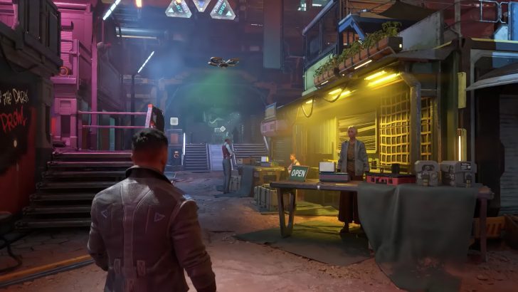 Neon-lit station interior with characters interacting at a kiosk.