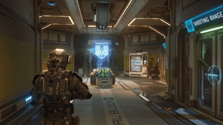 Futuristic security checkpoint with neon signage.