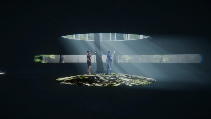Two people with futuristic attire stand in a dark room with a tree in the center, illuminated by beams of light.