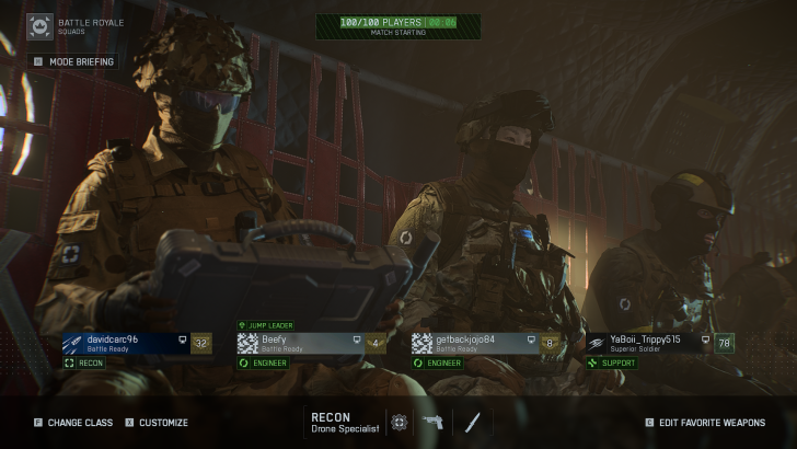 Soldiers in a helicopter prepare for a Battle Royale with on-screen text showing player names and roles.